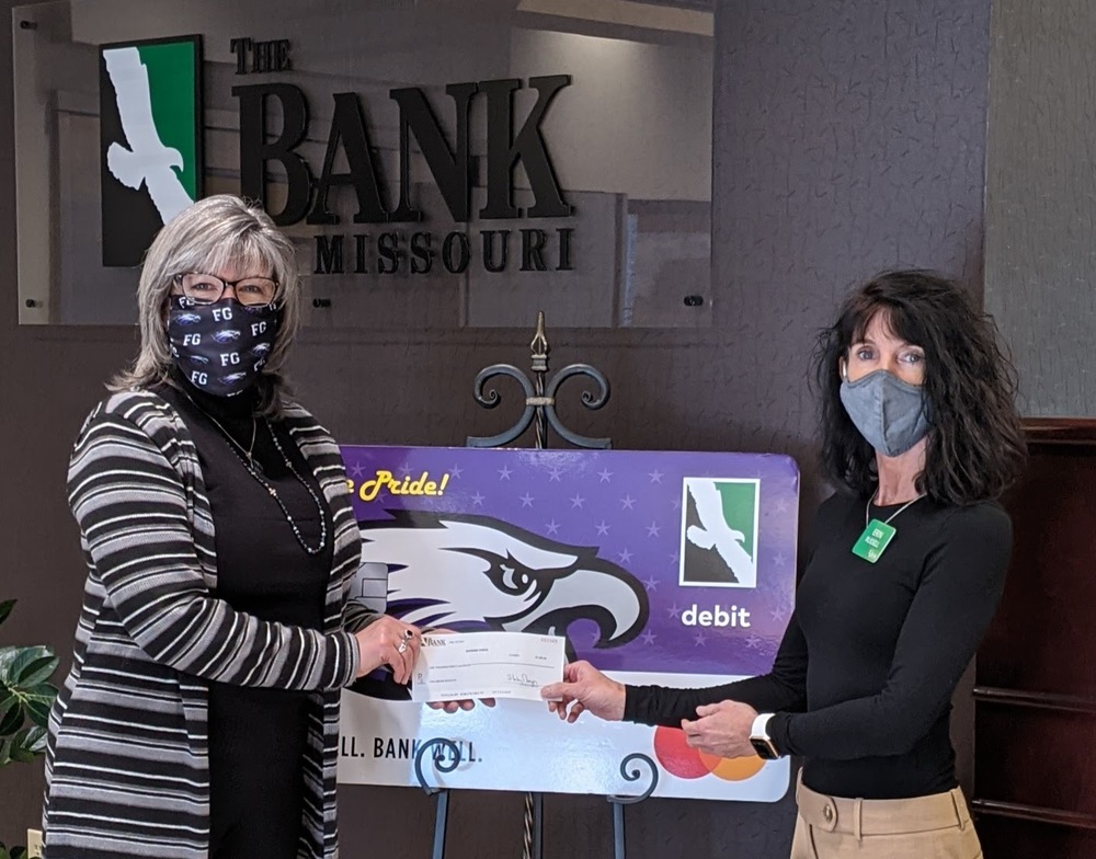 Erin & Lisa with Eagle Pride Debit Donation ck